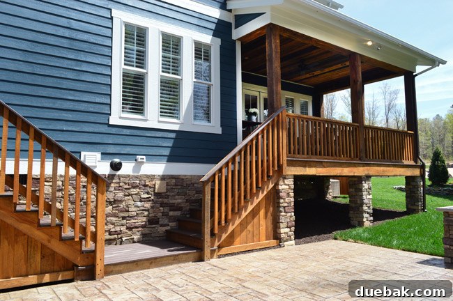 Two staircases leading from the patio; one to the mudroom with storage, the other to the back porch.