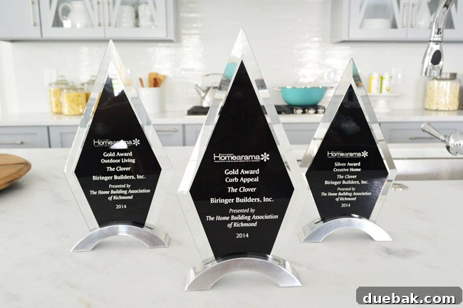 Close-up view of the award plaques, showing Gold for Curb Appeal and Outdoor Living, and Silver for Creative Home.