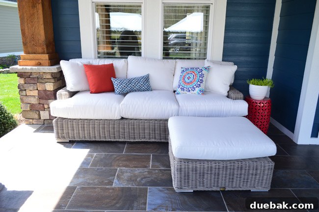 Another perspective of the front porch seating, highlighting the comfort and design of the Arhaus furniture.