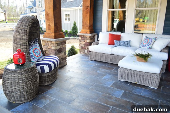 Swiveling egg chair and side table from Green Front Furniture on the front porch.