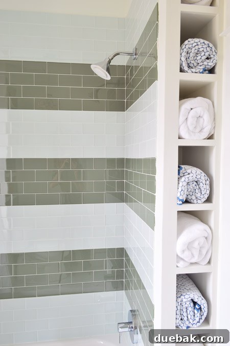 The Family Act 16 Towel storage nook behind a shower in a bathroom