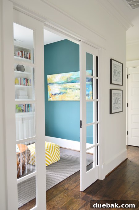 The Family Act 23 Hallway leading to a playroom with sliding French pocket doors