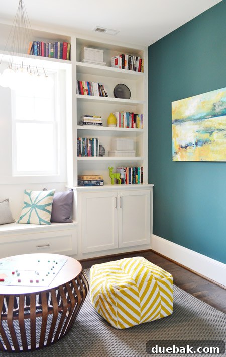 The Family Act 26 Playroom with a low table, two poufs, and a patterned rug
