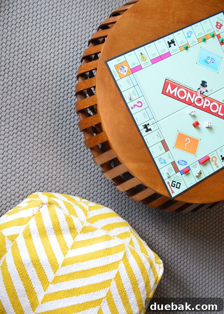 The Family Act 27 Monopoly board game set up on a low table in a playroom