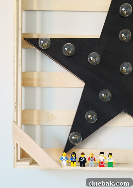 The Family Act 6 Close-up of a decorative star light framed by a wooden crate