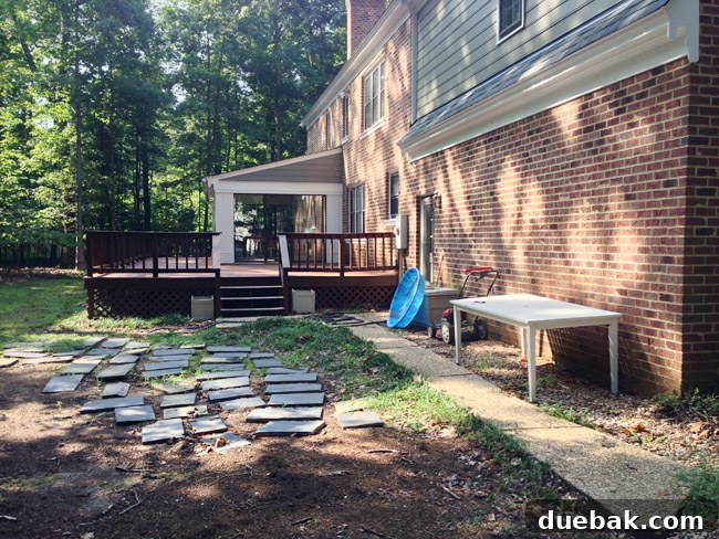 Before Photo of Backyard Area With Messy Unorganized Items After Move In