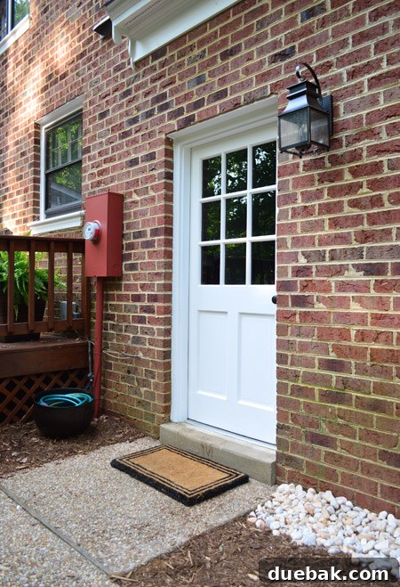 Close Up Of Updated Outdoor Area With Painted Door New Light And Disguised Electrical Box