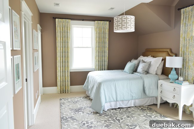 Our Showhouse: Full Video Walkthrough 18 Guest bedroom with brown walls, white bed, and colorful art