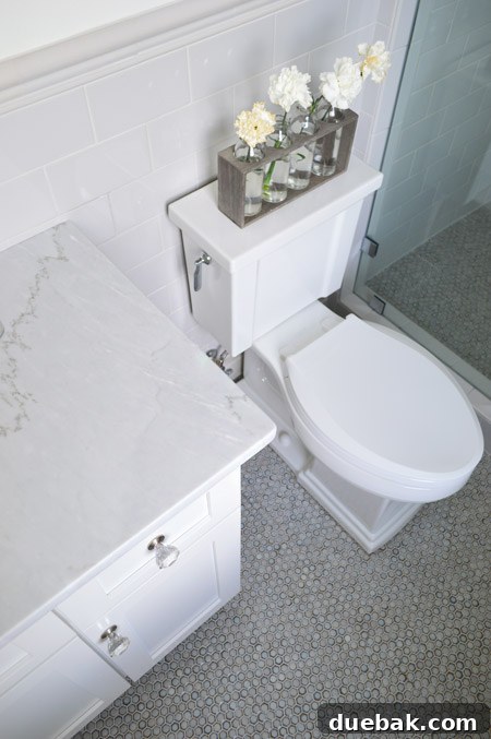 Our Showhouse: Full Video Walkthrough 26 Guest bathroom shower with continued wainscot tile and wood bench