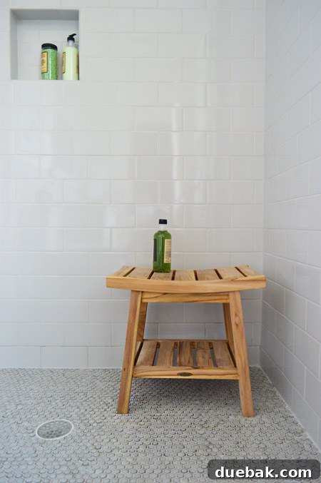 Our Showhouse: Full Video Walkthrough 27 Detailed view of guest bathroom shower with tile and bench