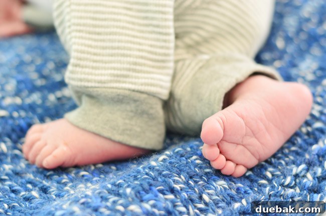 DIY Newborn Photo Of Infant Feet On Blue Blanket For Birth Announcement