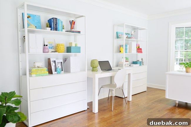 Overview of the organized desk and bookcase wall in home office