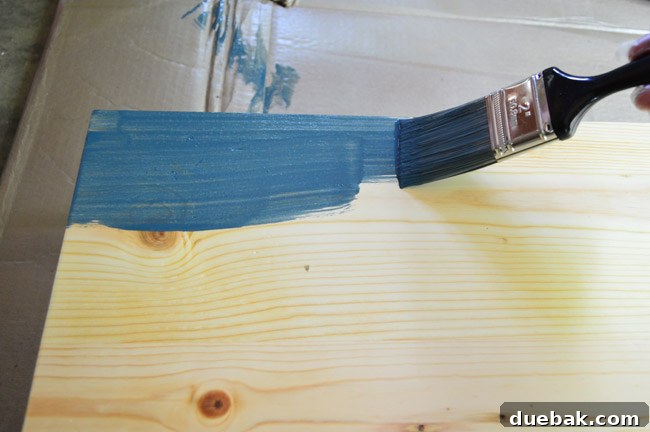 Thrifted Coffee Table's Bold Blue Stain Makeover 14 The wood tabletop during the initial application of the vibrant blue stain