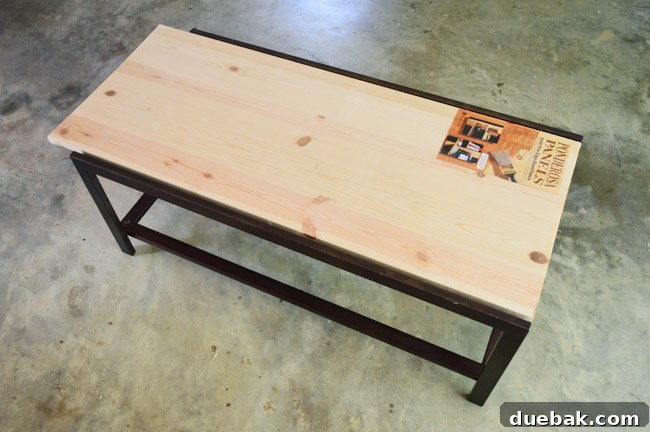 Thrifted Coffee Table's Bold Blue Stain Makeover 8 Pre-cut wood panel purchased from Lowe's, ready for the coffee table top