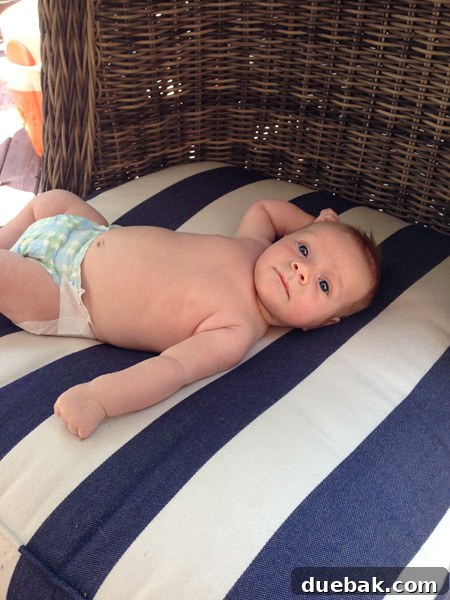 John, the family member, enjoying a moment of relaxation in the comfortable wicker egg chair on the outdoor patio