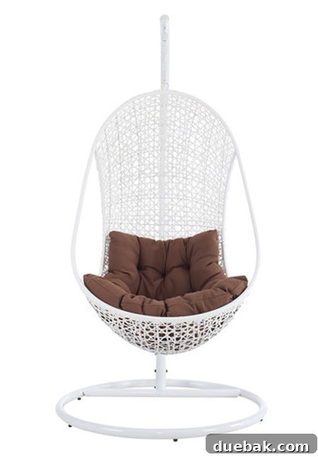 A contemporary stand-alone outdoor egg chair with a dark metal frame and comfortable cushion, perfect for a stylish patio