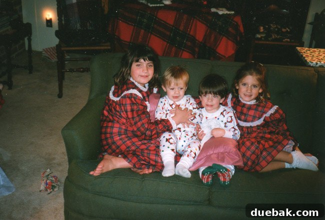 Children enjoying Christmas festivities in the house