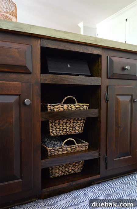 The finished, stained drawer fronts and shelf, blended to match the existing kitchen cabinetry.