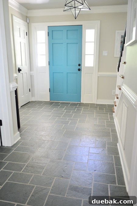 Newly stained grout in a foyer with tiled flooring