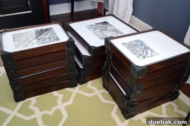 Collection of dark wood frames and white mats for gallery wall