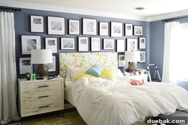 Initial gallery wall with frames above the bed