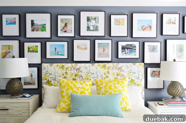 Completed gallery wall with colorful family photos in dark frames