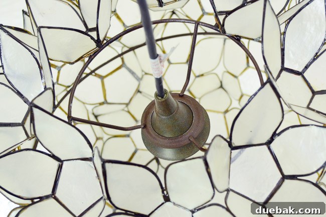 Close-up showing how the capiz fixture rests on the light kit