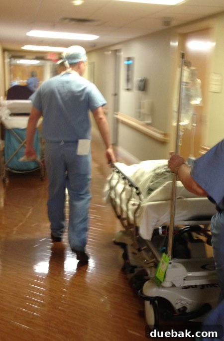 A pre-op photo, likely of the author in the hospital gown, reflecting a moment of quiet anticipation.