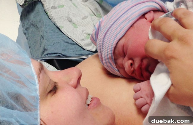 Teddy resting on his mother's chest during skin-to-skin, a tender first embrace.