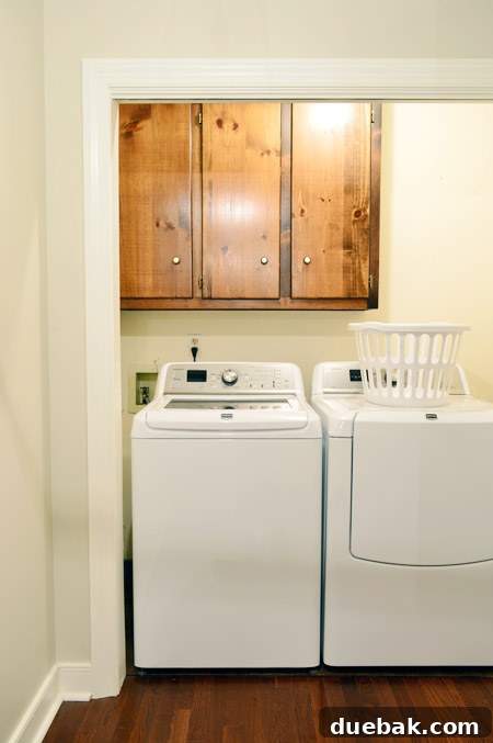 Our Laundry Room Transformation Begins 2 Laundry room before renovation with blue trim and outdated look