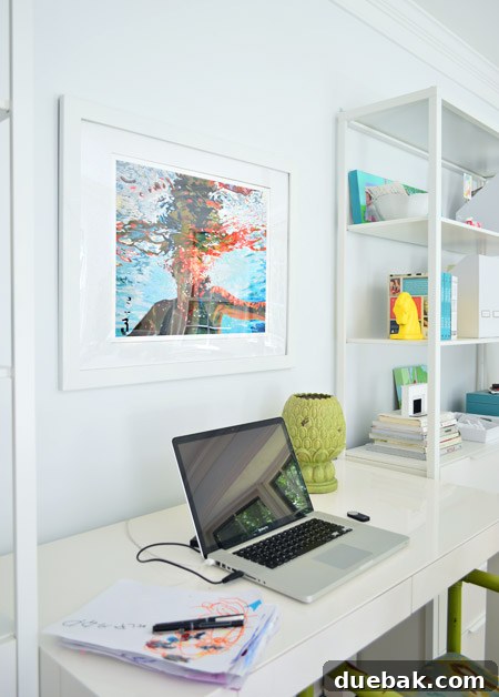 Samantha French print hanging above a desk in a home office, with shelves visible in the background.