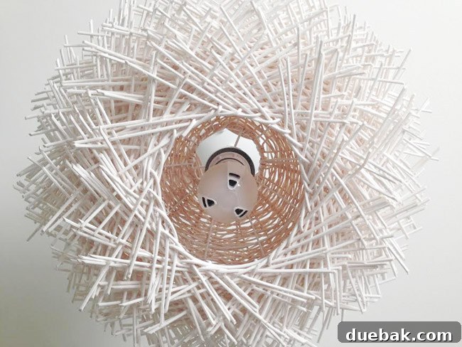 Upcycle Your Lamp into a Stunning Pendant Light 11 Converted stick light fixture with pendant cord and LED bulb