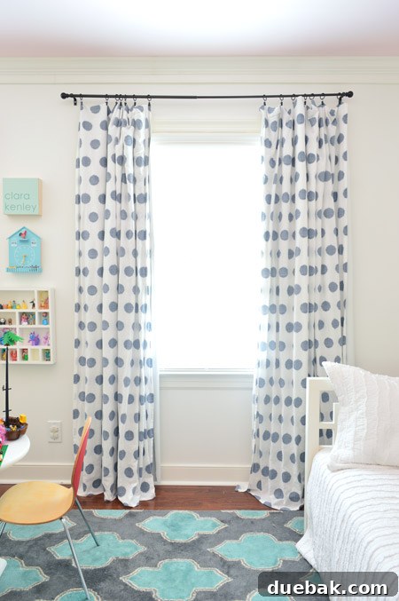 Clara's room with existing patterned curtains and a thin, sagging curtain rod, showing a busy aesthetic.