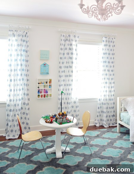 Full view of Clara's refreshed room with flipped curtains and new white rods, showing a playful and bright design.