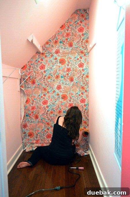 Transform Your Walls with Fabric 11 Corner of the closet wall with stapled fabric showing careful tension
