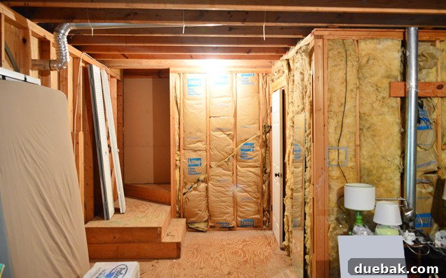 The Ultimate Laundry Room Makeover: From Demolition to Design 2 Before laundry room renovation showing old layout with appliances and cabinets
