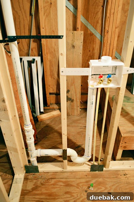The Ultimate Laundry Room Makeover: From Demolition to Design 17 Plumbing hook-ups being relocated by professional plumbers
