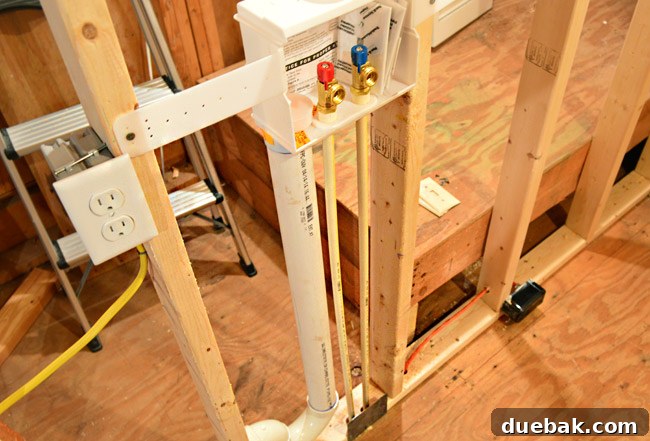 The Ultimate Laundry Room Makeover: From Demolition to Design 19 Electricians working on relocating outlets and switches