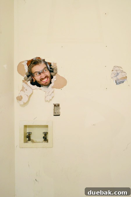 The Ultimate Laundry Room Makeover: From Demolition to Design 21 Second phase of drywall demolition for the laundry room