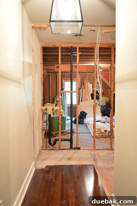 The Ultimate Laundry Room Makeover: From Demolition to Design 22 New natural light entering the hallway after wall demolition