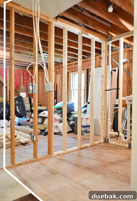 The Ultimate Laundry Room Makeover: From Demolition to Design 24 Space after framing removal, with lines indicating future wall placement