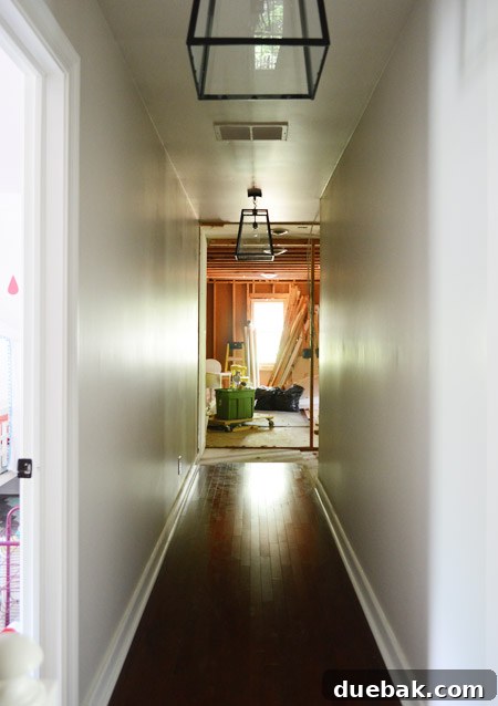 The Ultimate Laundry Room Makeover: From Demolition to Design 29 New natural light pouring into the hallway after renovation