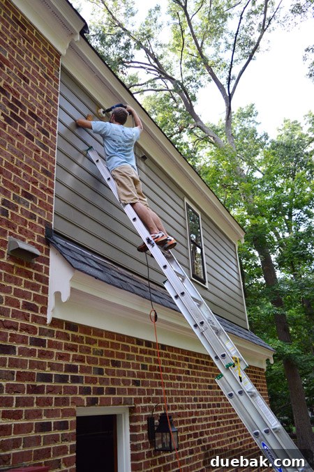 Routing New Laundry Exhaust Systems 14 Cutting a 4 1/8-inch hole in exterior siding for the new dryer vent, using a pilot hole for guidance and proper placement