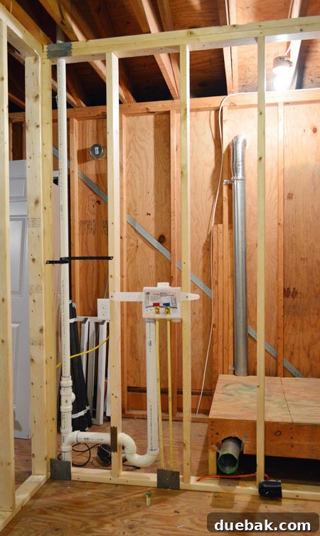 Routing New Laundry Exhaust Systems 20 Reattaching stair section after dryer vent installation, completing the pathway and securing the renovation step