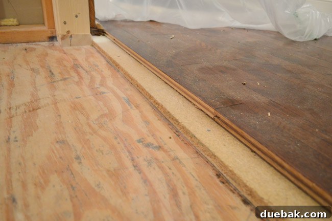 Routing New Laundry Exhaust Systems 21 Laundry room subfloor depth difference compared to adjacent hardwood, preparing for leveling and tiling