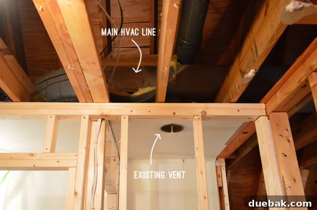 Routing New Laundry Exhaust Systems 24 Main HVAC trunk line in the attic, highlighting the absence of heating/cooling in the new laundry room before modifications