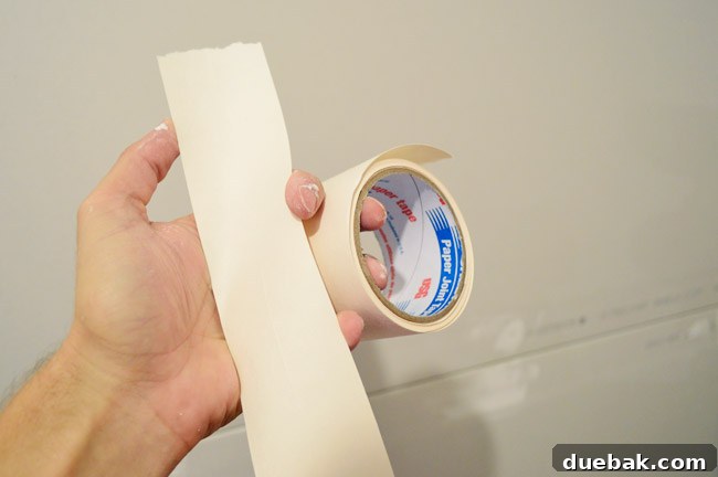 drywall tape shown torn and ready to apply