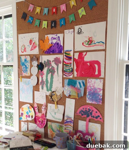 Repaired cork bulletin board holding children's artwork securely