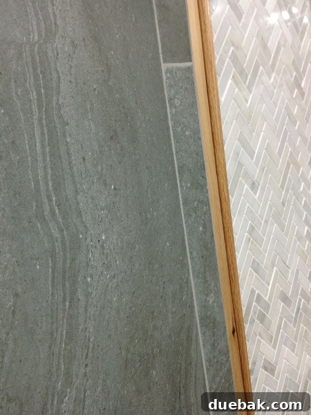 Blast Anthracite floor tile sample displaying its unique veins and variations, perfect for a modern laundry room.