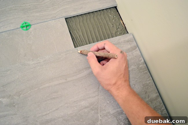Marking a tile for cutting before installation